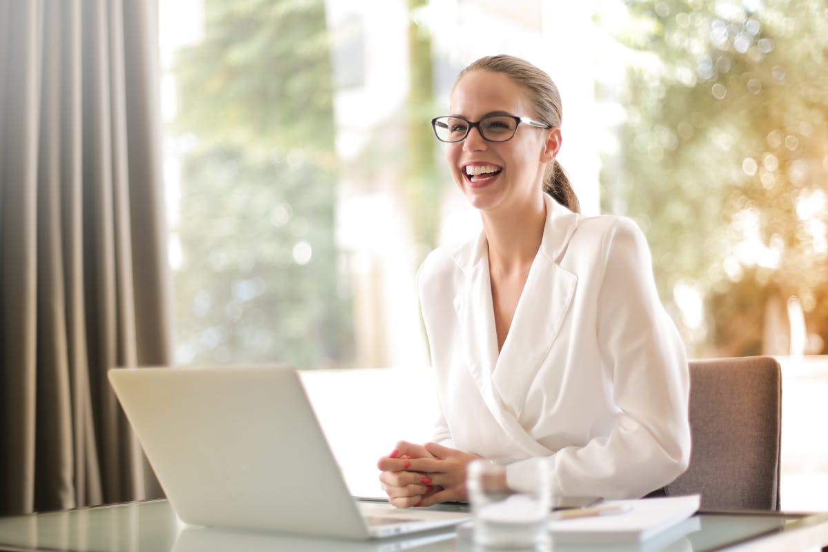 Woman with glasses using laptop